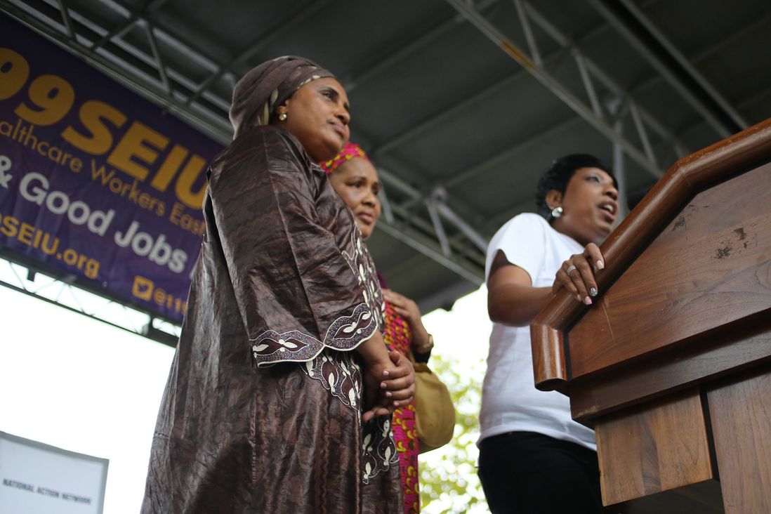 The mothers of Amadou Diallo and Mohamed Bah stand by Ramarley Graham's mother as she speaks to the rally.